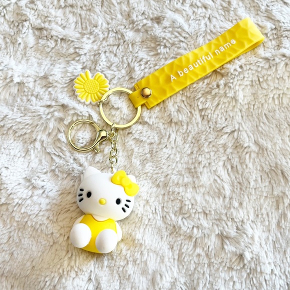 Sanrio Hello Kitty Yellow Keychain Bag Accessory Wristlet - Picture 1 of 2